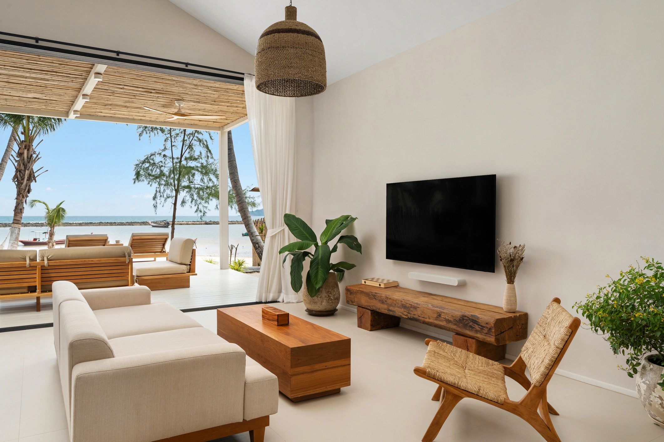 Modern Caribbean condo living room with ocean-view balcony